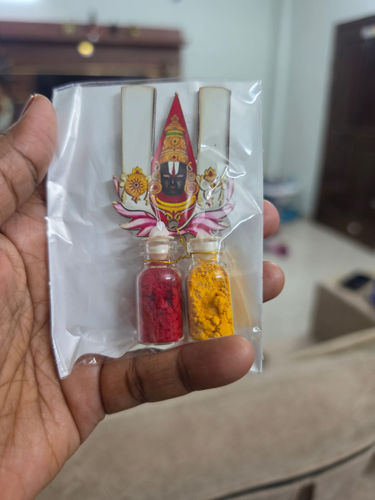 Kumkum and turmeric mini bottle set with a Balaji cutout